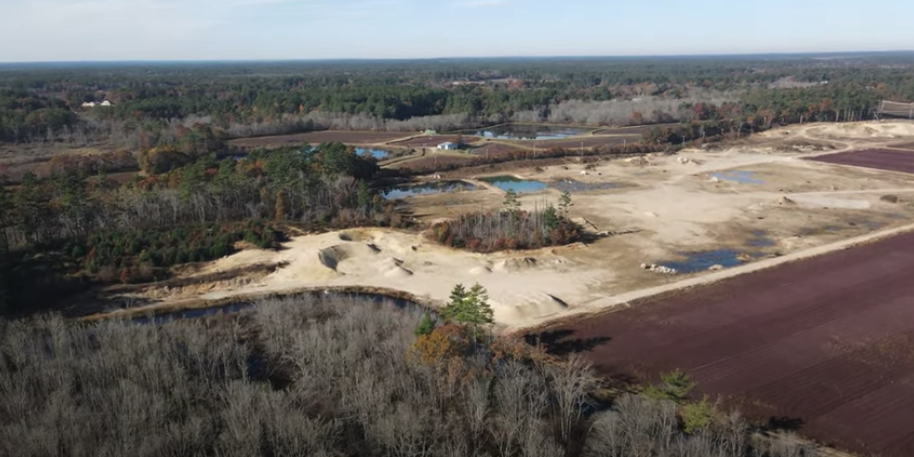 
Behind Southeastern Massachusetts cranberry bogs lies a corrupt web of sand and gravel mining. Corporations posing as cranberry farms get mining permits under the false pretense of Agricultural Excavation. Photo: cranberry bog and mining operation, Carver MA